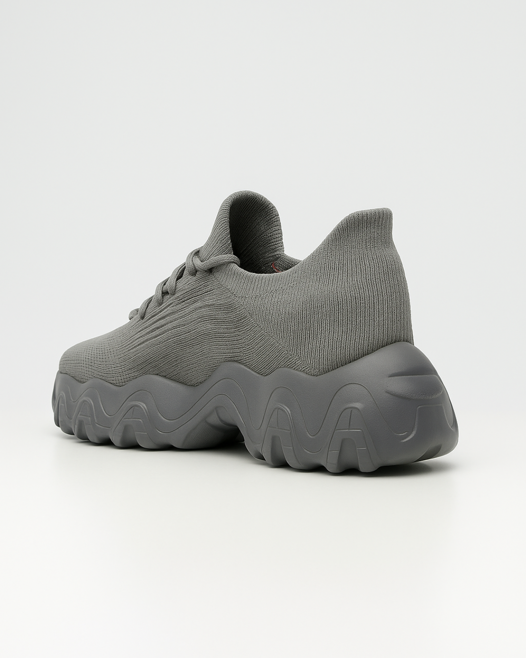 Rear angled view of OrthoEase Luxe Silver sneaker